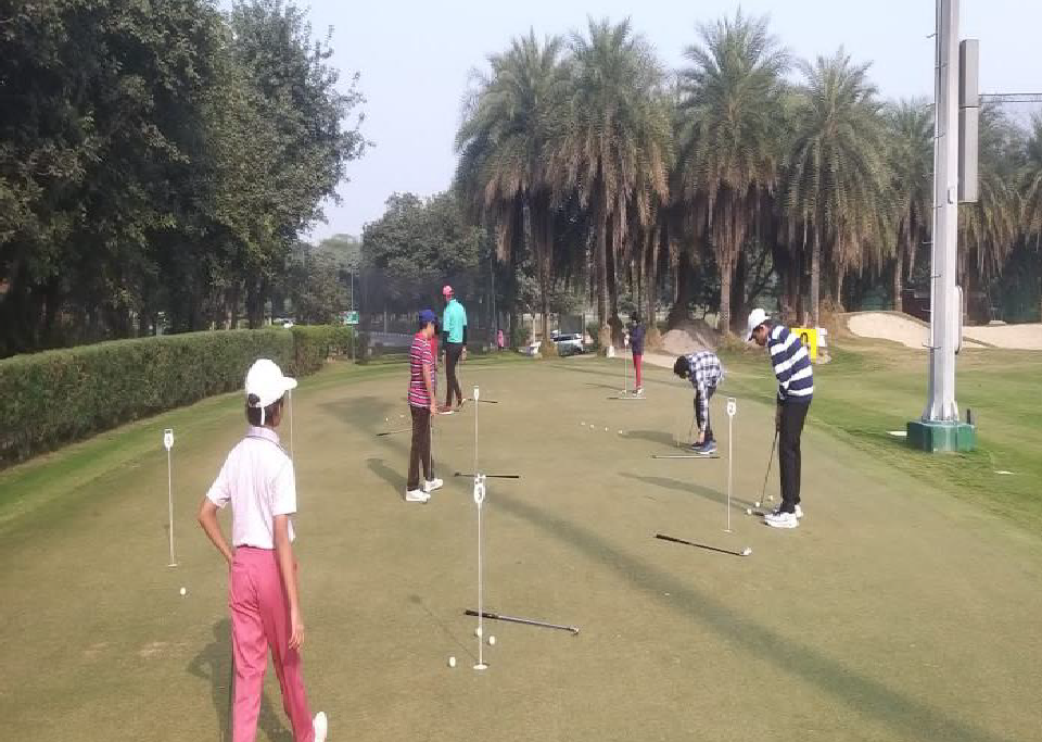Students practicing on a golf course